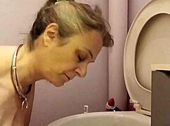 What does the housewife slave do in the toilet?