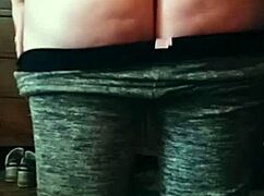 The brunette with a big sexy ass performs an enticing booty drop in the scene.