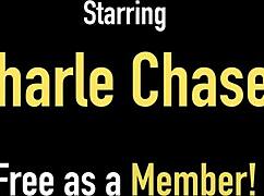 Charlee Chase is playing with her big tits and that dildo, you know?