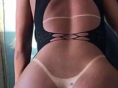 The transsexual model in crossdressing shows off her ass proudly.