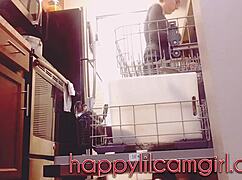 tall girl dominates kitchen cleaning while recording voyeur webcam.