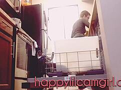 tall girl dominates kitchen cleaning while recording voyeur webcam.