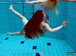 two hot lesbians makin out in the pool underwater