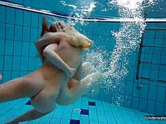 two hot lesbians makin out in the pool underwater