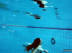 two hot lesbians makin out in the pool underwater