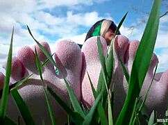 goddess feet in cute white socks on spring grass field