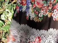 look at that hairy mature flashing her pussy in the park