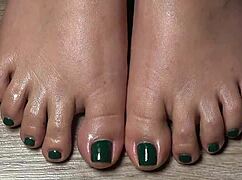 Close-Up View Of Green-Nailed Toes For Your Fetish