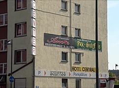 a tourist explores outside eros center amor in frankfurt germany, european adventure.