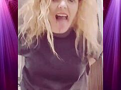 Intensely shaking booty in boyfriend's clothes during dominant dance.