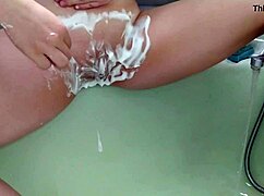 Sexy Milf Shaves Her Hairless Pussy in Shower