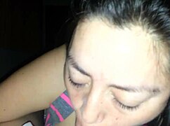 My wife gives a rich blowjob with her mouth on my cock in our bedroom. She uses her tongue skillfully.