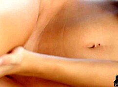 Amber Sym strips slowly, showing her big natural tits