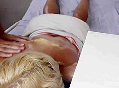 Watch the blonde wife get bent over and fucked doggystyle in the massage parlor.