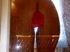 Is this girl with an appetizing ass having fun in the shower with a pink dick?