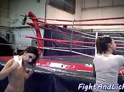 European Women Engage In An Intense Wrestling Match On The Floor, Showcasing Their Strength And Agility.