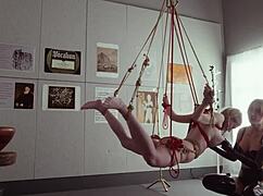 Submissive bondage puppet Rebel Rhyder sucks cock and eats ass in a demented threesome game