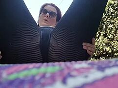 nicoletta embraces nature with dirty feet in public garden yoga