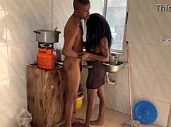 Newly married couple having passionate sex in the kitchen