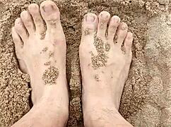 bare feet play in the sand