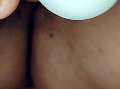 mature woman casually masturbates with her dildo in a relaxed home setting