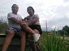 People enjoying oral activities in the park with amateurs and latinas.