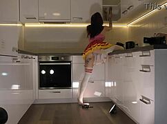 hottest redhead cheerleader shows see through panties in kitchen