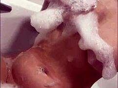 horny british slut plays with herself in the shower