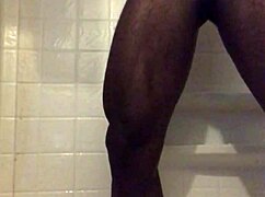 He strokes his monster black cock in the homemade shower solo.