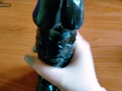 teasing handjob on huge black dildo using sexy gloves